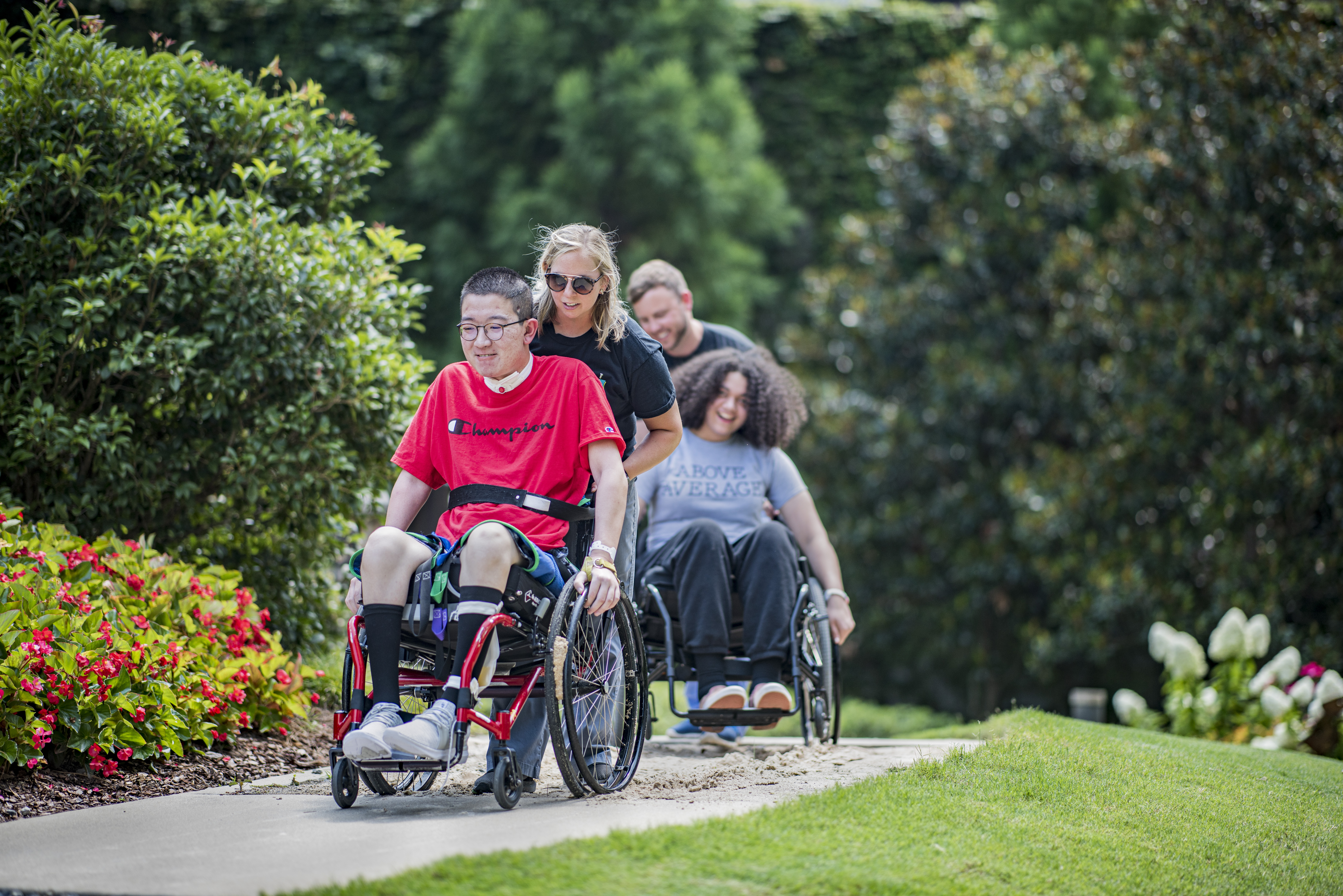 Patients work on wheelchair skills outside